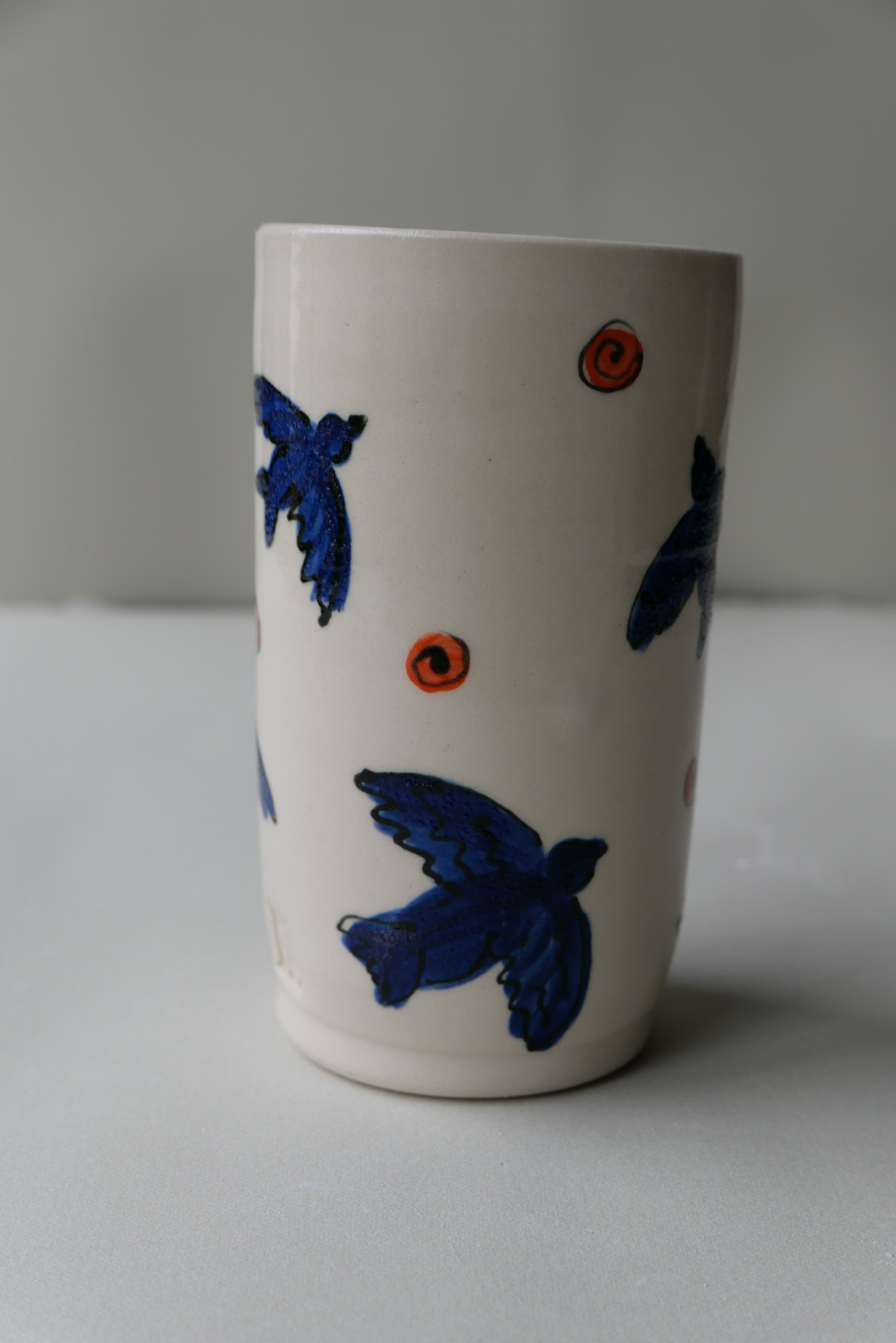 blue and orange bird tumbler no. 1