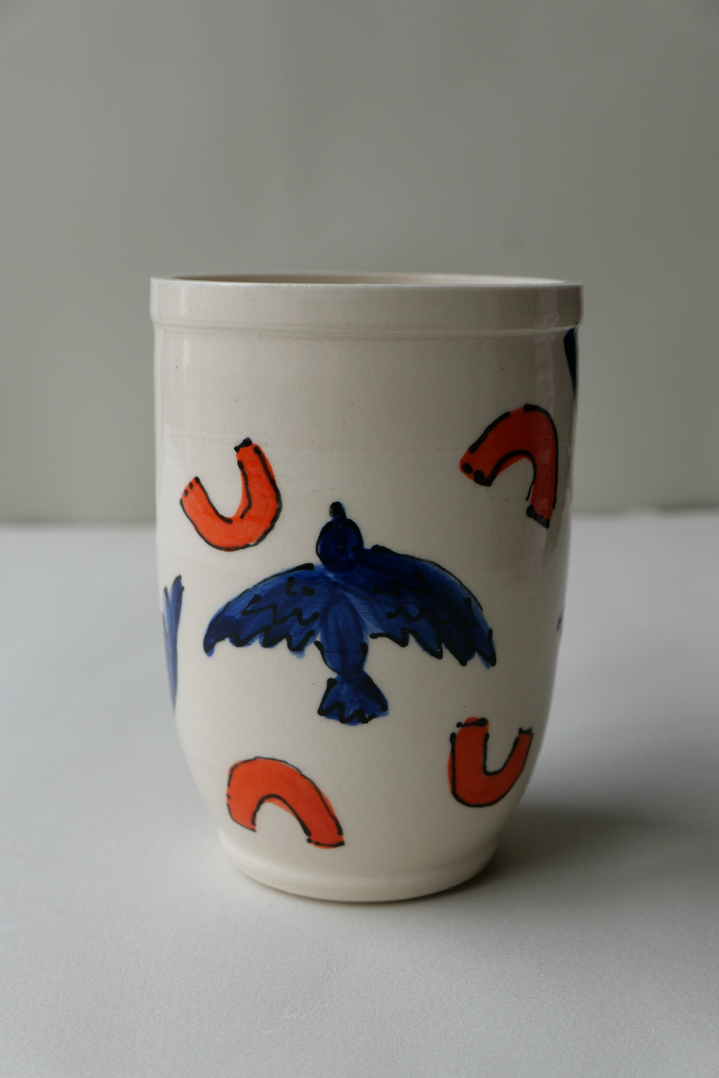 blue and orange bird tumbler no. 2