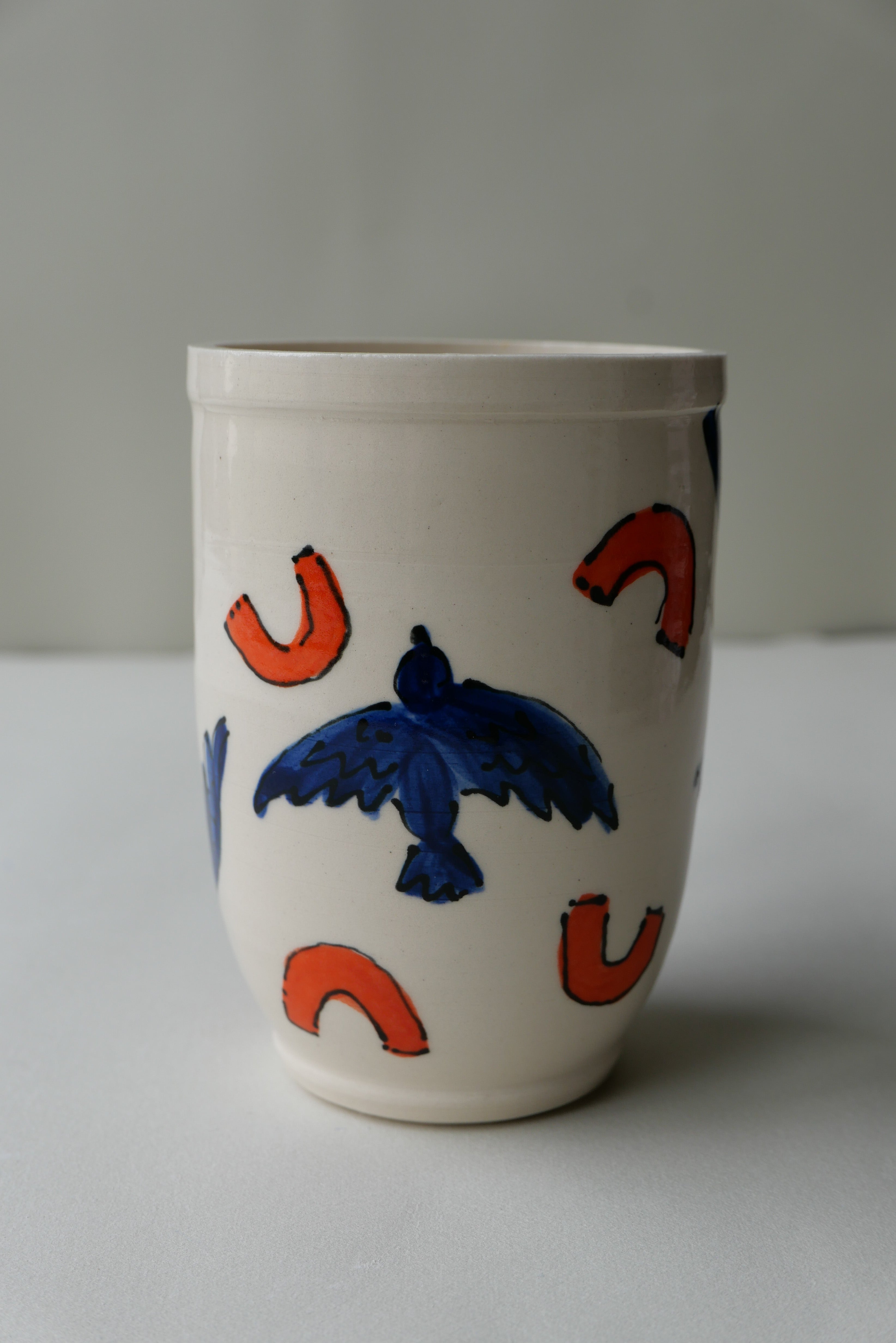 blue and orange bird tumbler no. 2