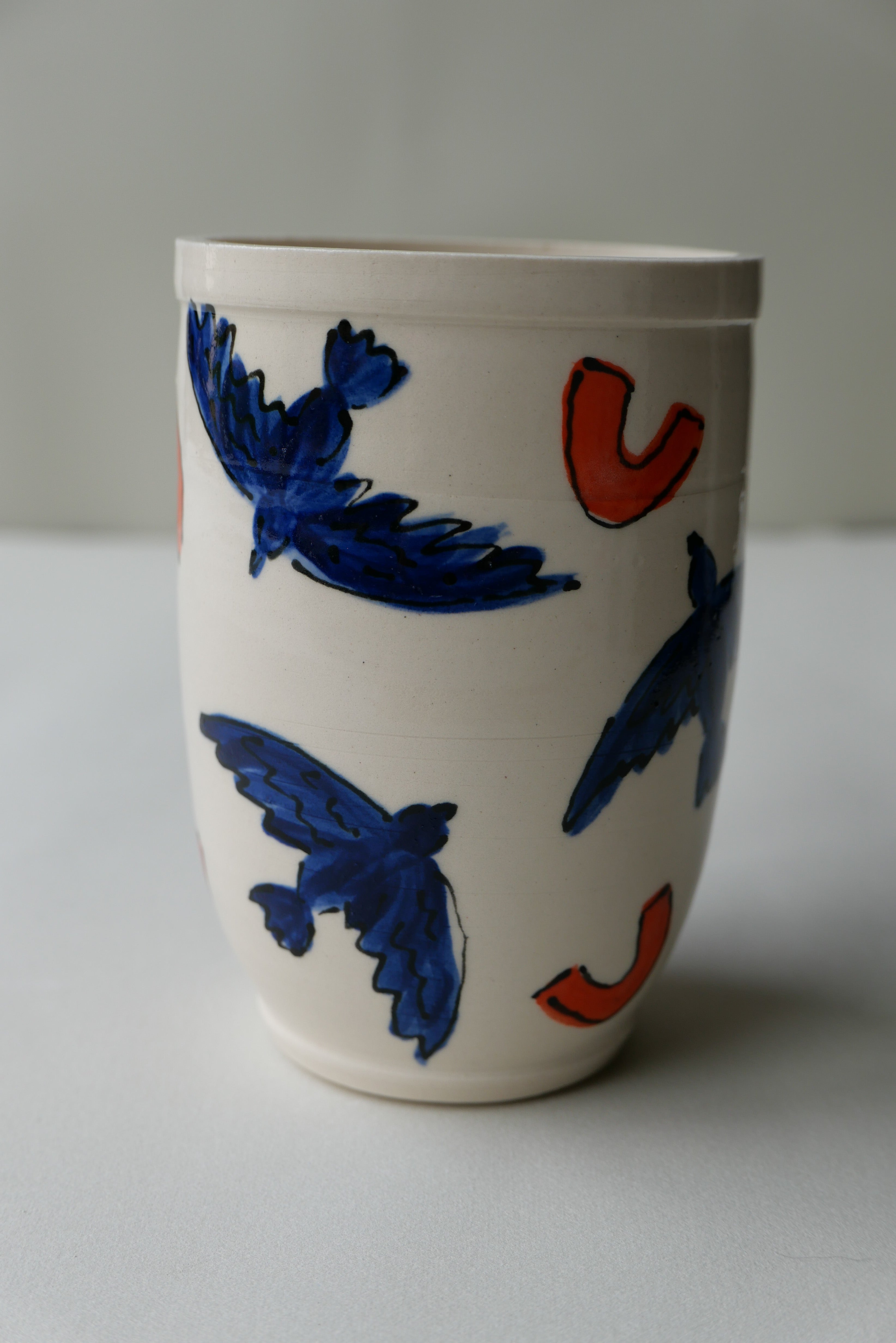 blue and orange bird tumbler no. 2